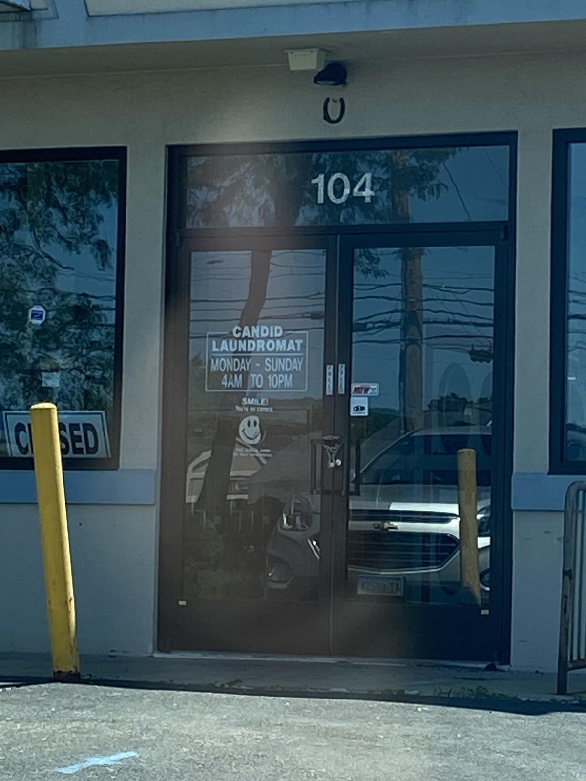 The glass front door marked 104 at 104 Washington Ave. in North Haven, shown when the space was still Candid Laundromat