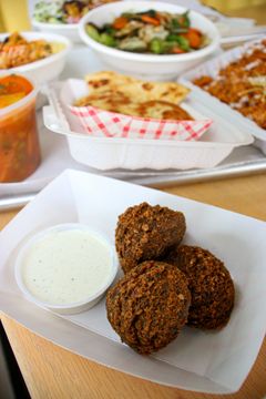 Falafel with a side of white sauce at Ali Baba’s Kitchen