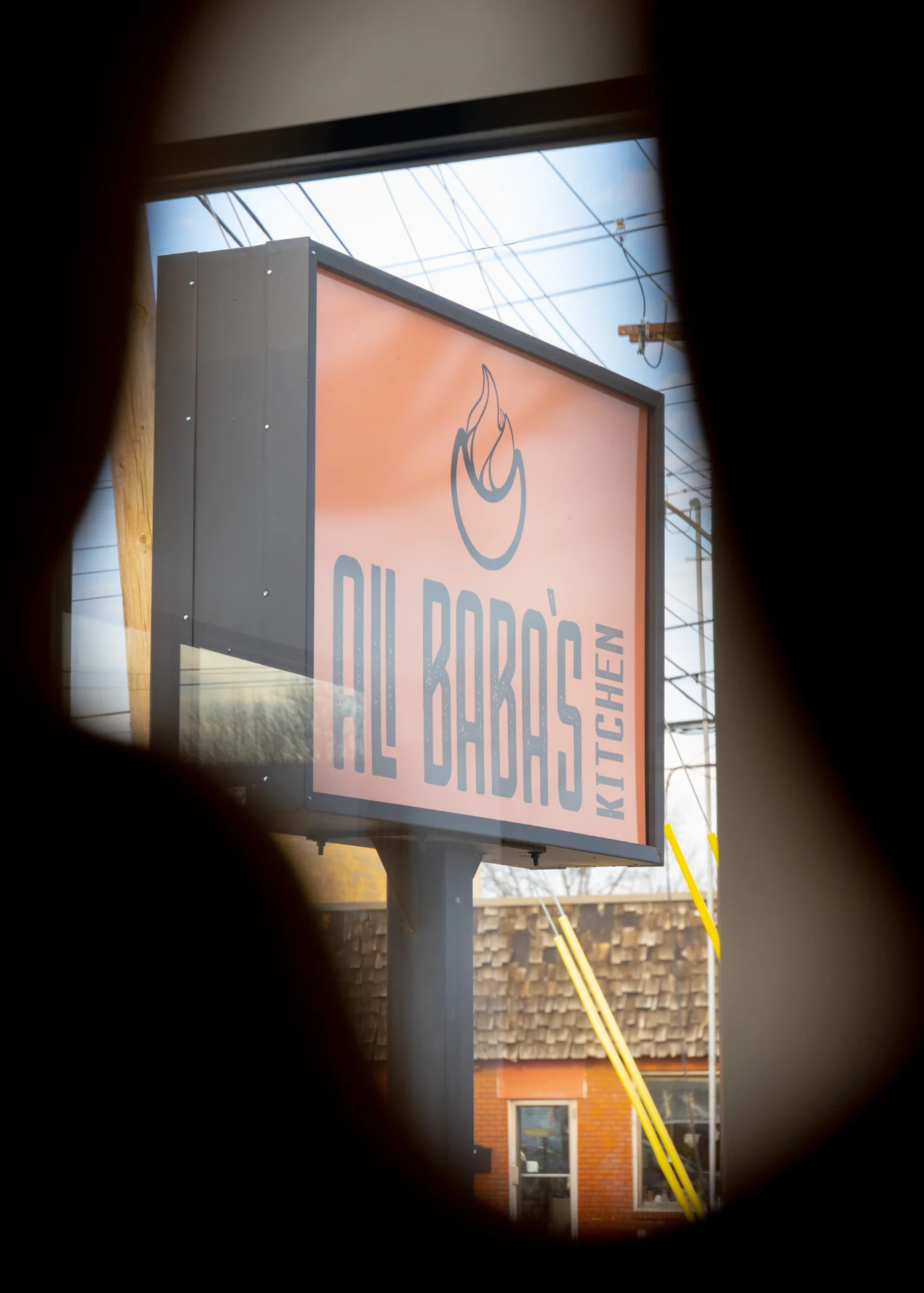 The orange Ali Baba’s Kitchen sign