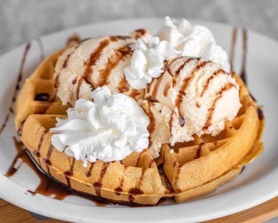 Waffle sundae with vanilla ice cream, chocolate syrup and whipped cream at the Athena II Diner