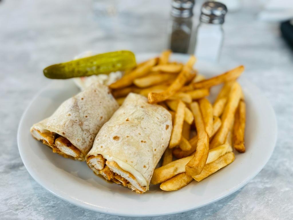 A wrap platter with french fries and a pickle at the Athena II Diner
