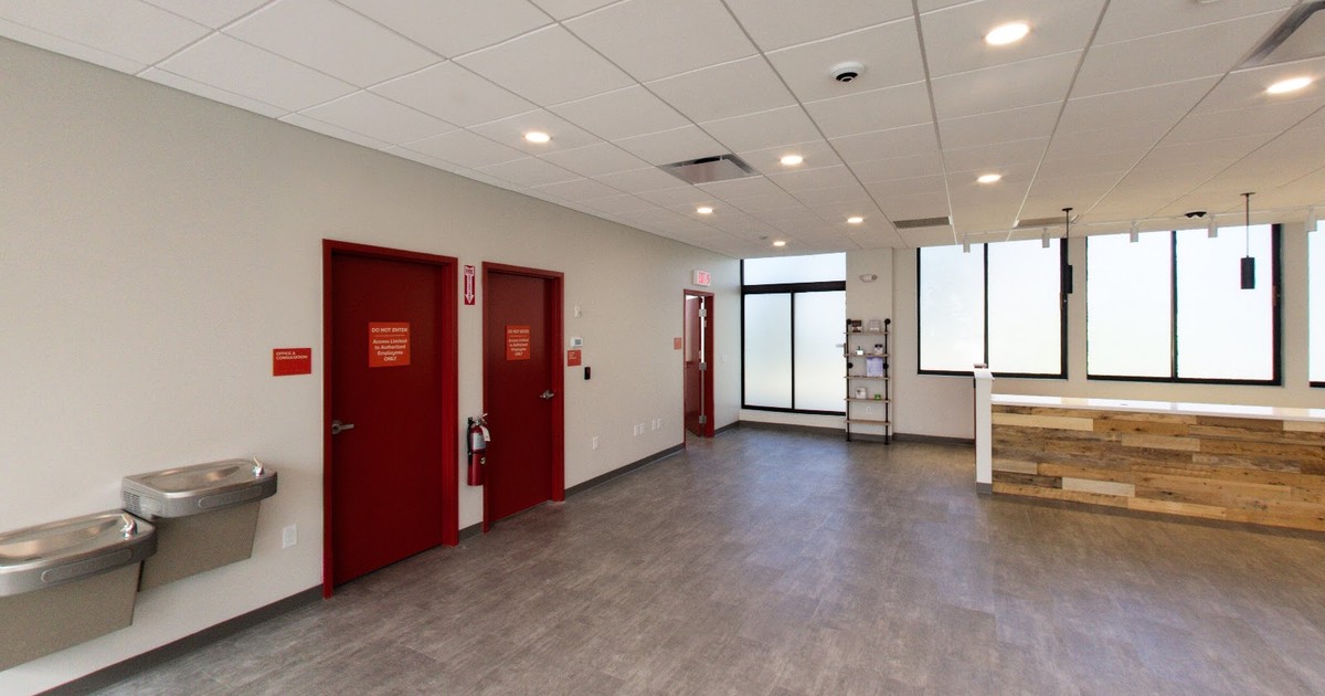 The sales floor inside Fine Fettle at 104 Washington Ave. in North Haven, with red doors and a wood counter