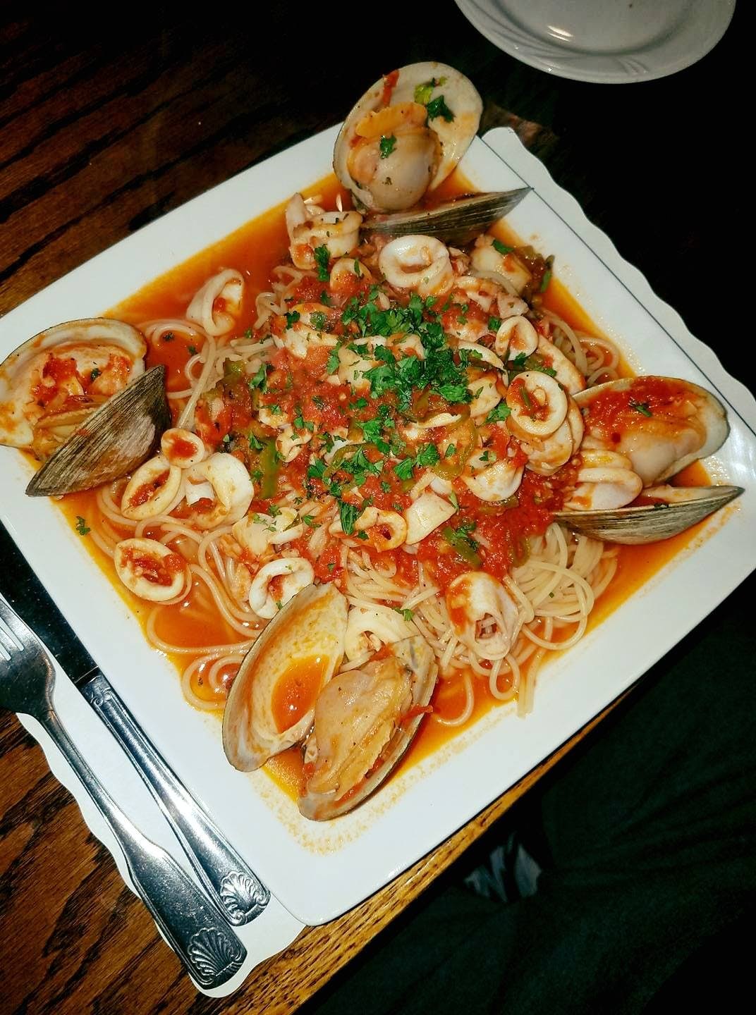 A platter of calamari and shellfish over linguine in red sauce at Gagliardi's
