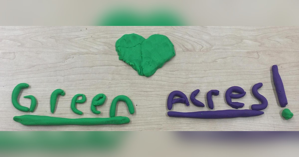 The words Green Acres! spelled out in green and purple clay with a green heart, from Green Acres Elementary School in North Haven