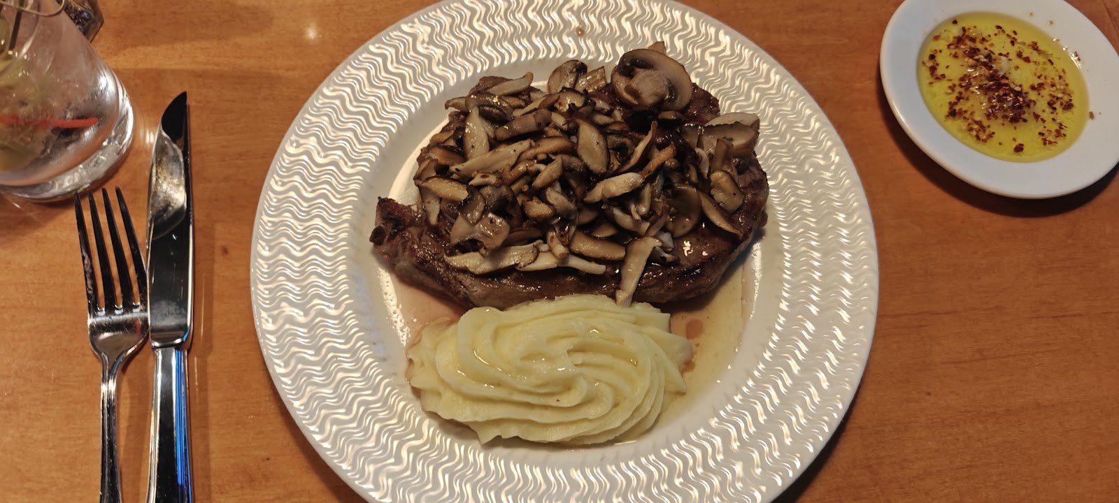 NY strip steak topped with wild mushrooms and onions, with mashed potatoes, at Josephs on Whitney