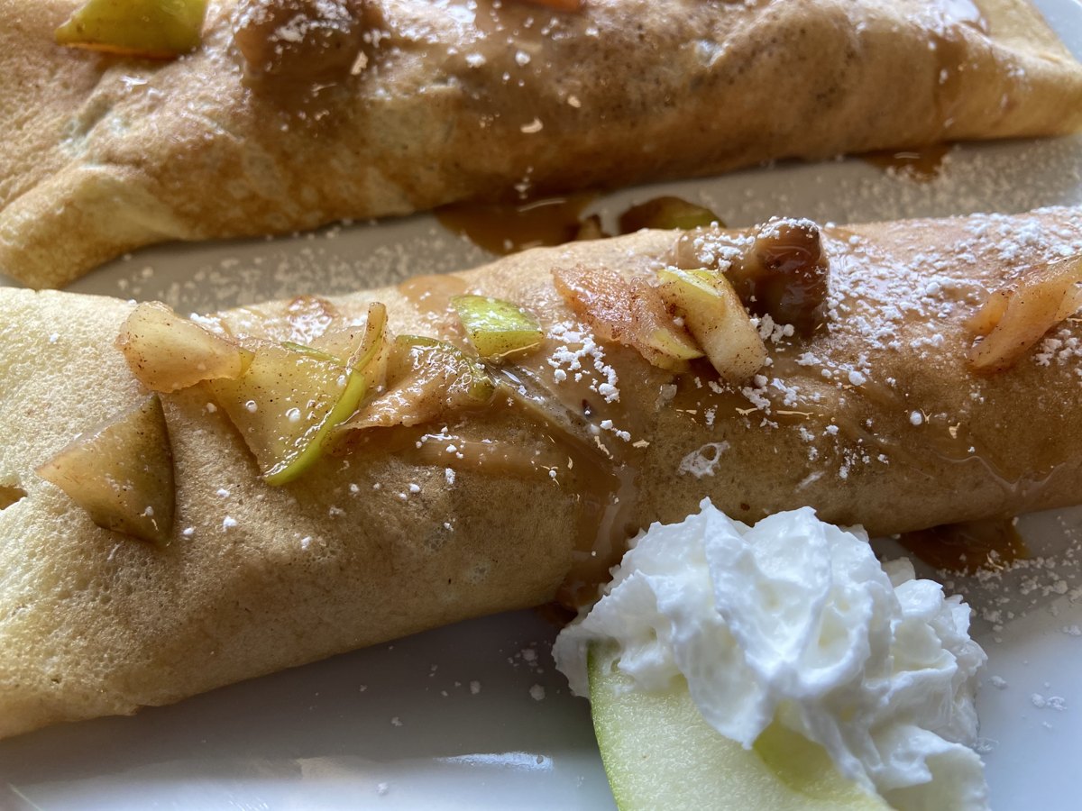 The Apple crêpe at Sam's Place, filled with thin-sliced apples and walnuts with caramel sauce and whipped cream