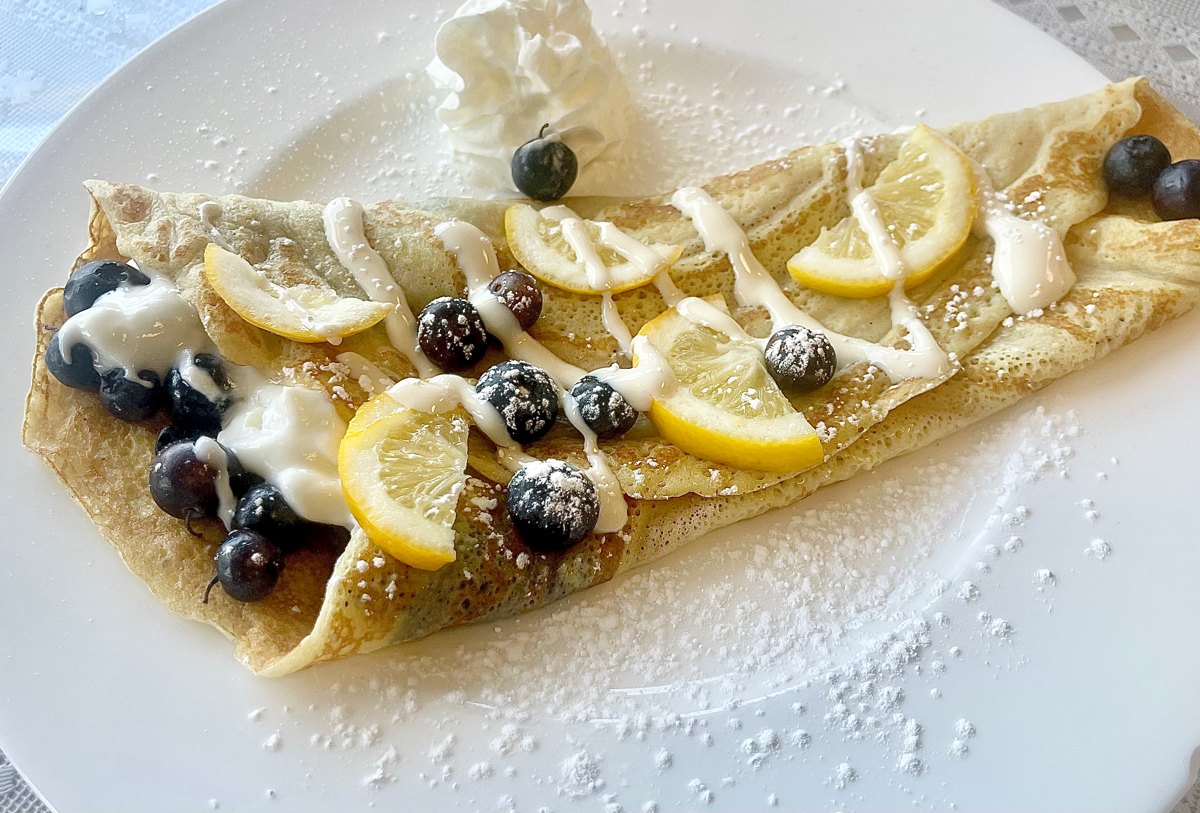 The Blue Limoncello crêpe at Sam's Place topped with lemon slices, blueberries and powdered sugar