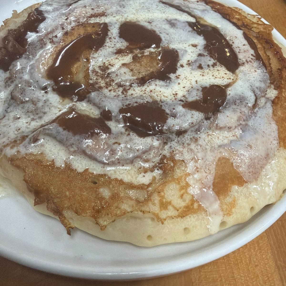 Cinnamon roll pancakes with icing