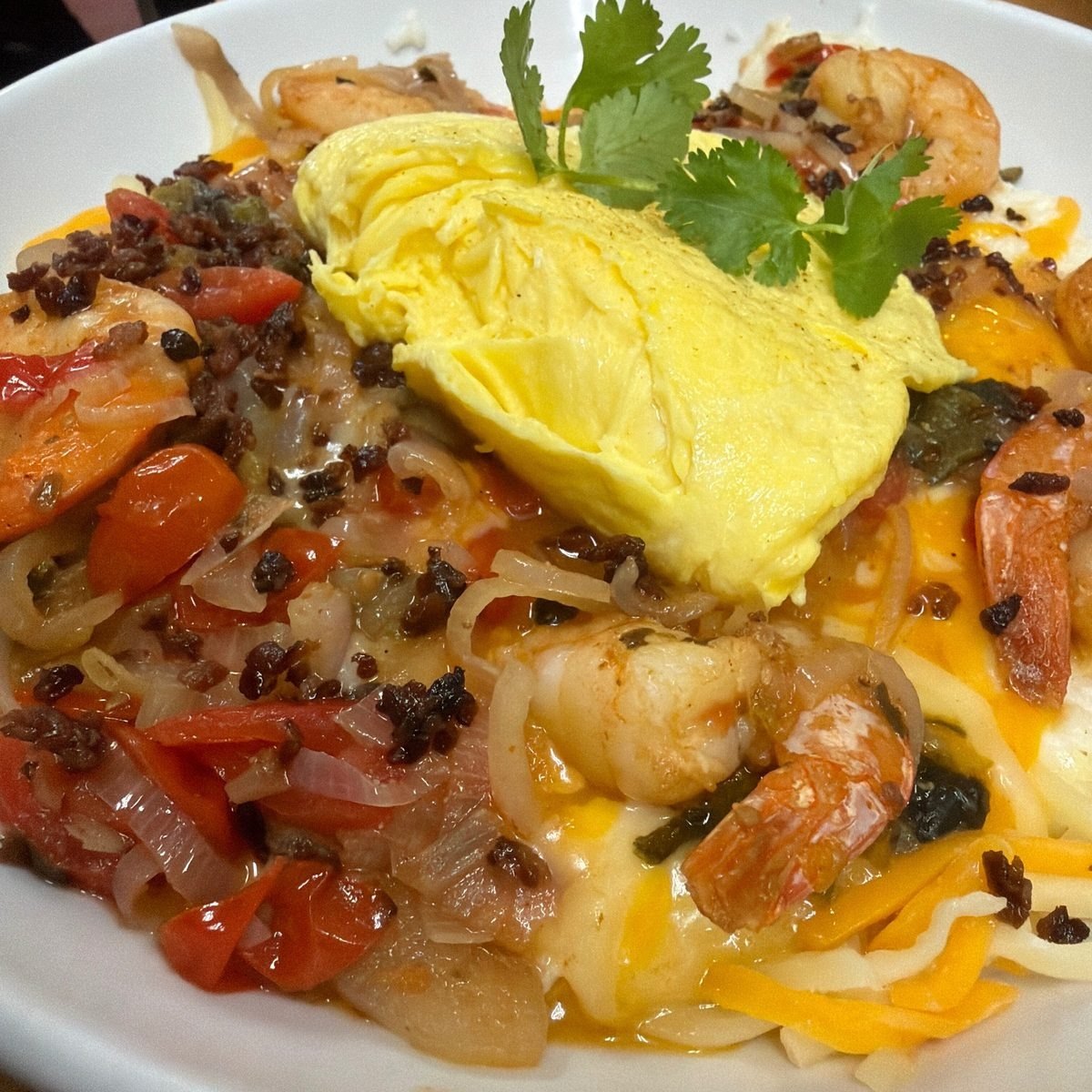Shrimp and grits topped with scrambled eggs at State Street Cafe