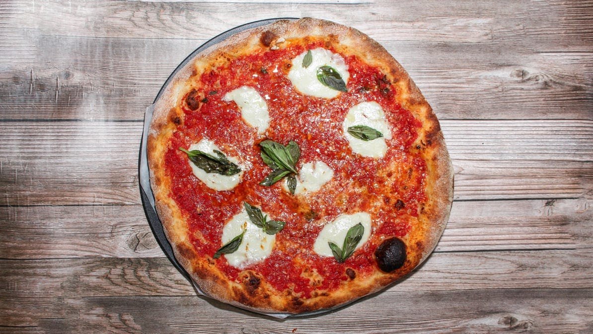 A Classic Margherita pizza with fresh mozzarella and basil from Venezia Pizza
