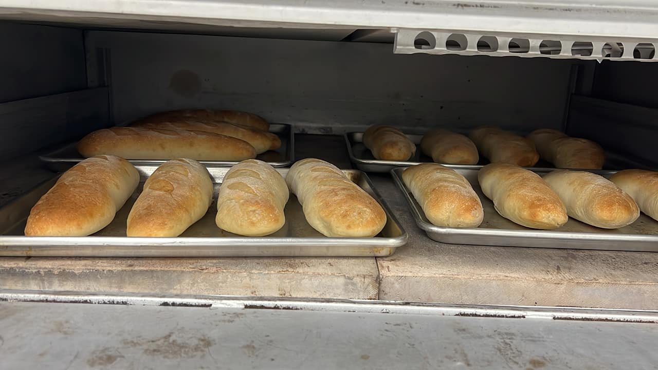 Loaves of fresh bread baking in the oven at Venezia Pizza