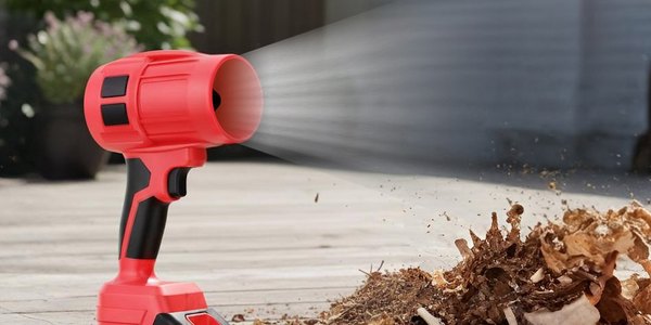 Red Wood Ranger cordless leaf blower clearing leaves from a patio